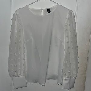 white blouse with sheer polka dot sleeves